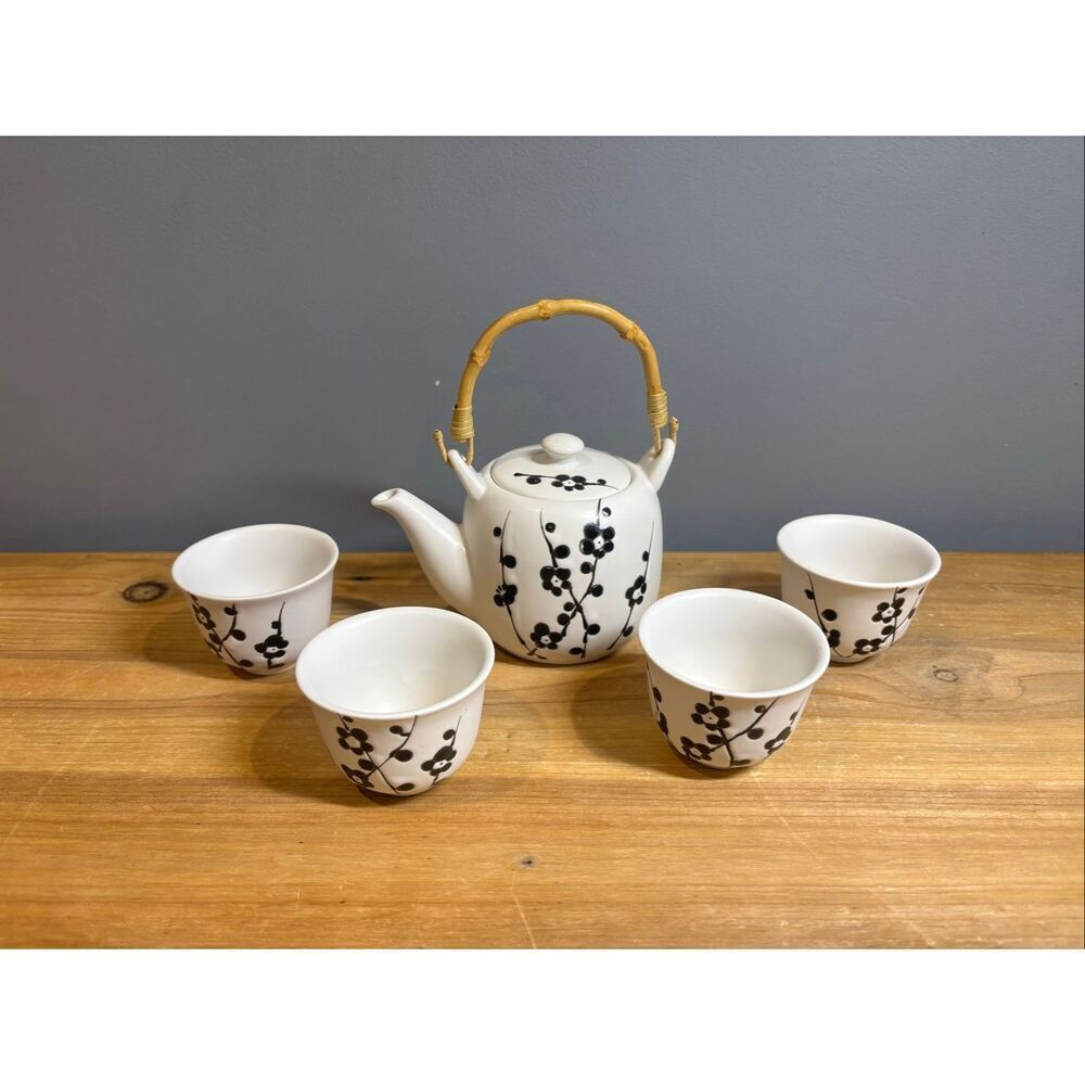 White ceramic tea pot and 4 tea cups with black cherry blossoms